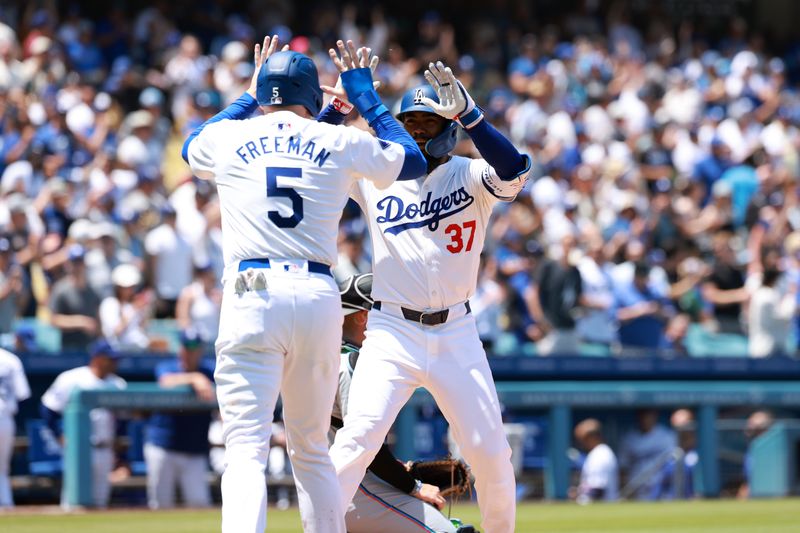 May 8, 2024; Los Angeles, California, USA;  Los Angeles Dodgers outfielder Teoscar Hernandez (37) celebrates with first base Freddie Freeman (5) after hitting a two-run home run during the sixth inning against the Miami Marlins at Dodger Stadium. Mandatory Credit: Kiyoshi Mio-USA TODAY Sports