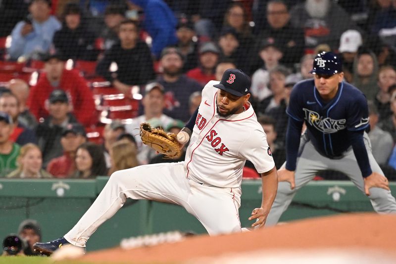 May 16, 2024; Boston, Massachusetts, USA; Boston Red Sox first baseman Dominic Smith (2) can't make a catch at first base during the fourth inning against the Tampa Bay Rays at Fenway Park. Mandatory Credit: Eric Canha-USA TODAY Sports