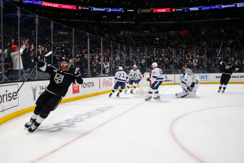 Mar 23, 2024; Los Angeles, California, USA; Los Angeles Kings defensemen Vladislav Gavrikov (84) celebrates after scoring a goal in overtime against the Tampa Bay Lighting at Crypto.com Arena. Mandatory Credit: Yannick Peterhans-USA TODAY Sports