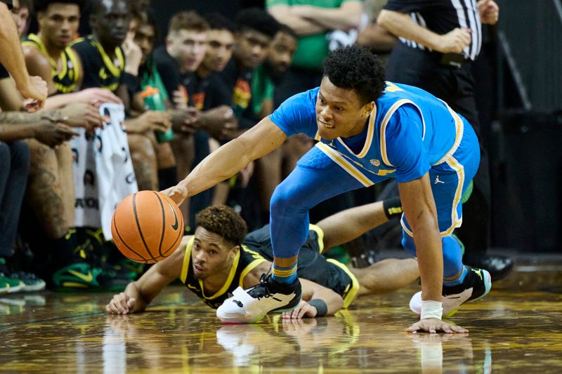 Feb 11, 2023; Eugene, Oregon, USA;  UCLA Bruins guard Jaylen Clark (0) steals the basketball during the second half against Oregon Ducks guard Keeshawn Barthelemy (3) at Matthew Knight Arena. Mandatory Credit: Troy Wayrynen-USA TODAY Sports