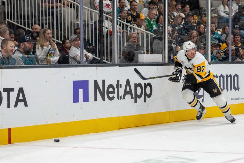 Oct 18, 2025; San Jose, California, USA; Pittsburgh Penguins center Sidney Crosby (87) skates after the puck behind the net against the San Jose Sharks during first perioid at SAP Center at San Jose. Mandatory Credit: Neville E. Guard-Imagn Images