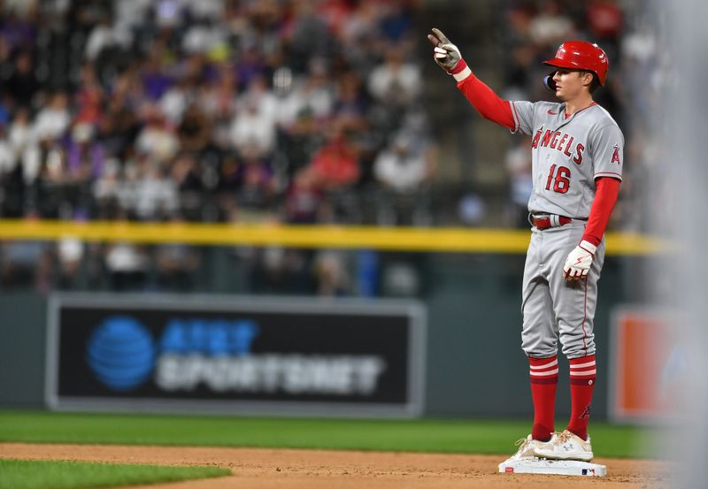 Jun 24, 2023; Denver, Colorado, USA; Los Angeles Angels right fielder Mickey Moniak (16) stands on second base with a double in the eighth inning as he gestures to the dugout against the Colorado Rockies at Coors Field. Mandatory Credit: John Leyba-USA TODAY Sports