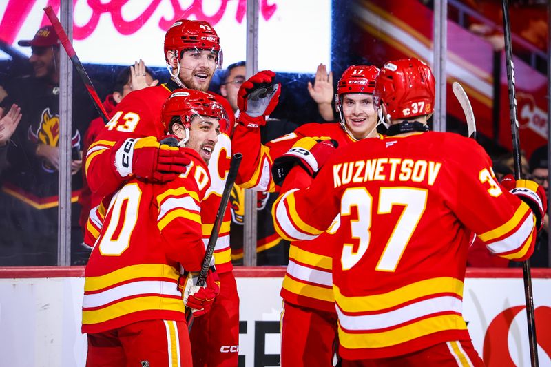 Nov 5, 2025; Calgary, Alberta, CAN; Calgary Flames right wing Adam Klapka (43) celebrates his goal with teammates against the Columbus Blue Jackets during the second period at Scotiabank Saddledome. Mandatory Credit: Sergei Belski-Imagn Images