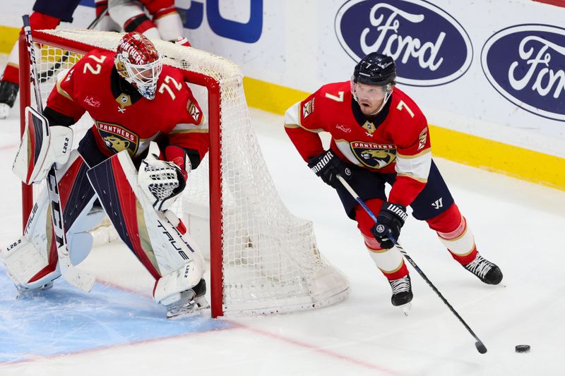 Jan 13, 2024; Sunrise, Florida, USA; Florida Panthers defenseman Dmitry Kulikov (7) moves the puck against the New Jersey Devils during the third period at Amerant Bank Arena. Mandatory Credit: Sam Navarro-USA TODAY Sports