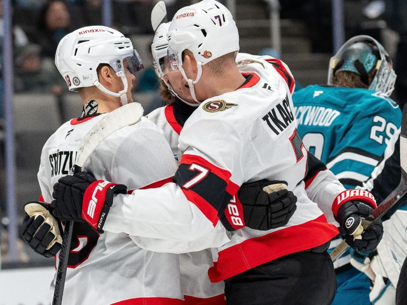 Nov 27, 2024; San Jose, California, USA; Ottawa Senators center Tim Stützle (18) ad Ottawa Senators right wing Adam Gaudette (81) and Ottawa Senators left wing Brady Tkachuk (7) celebrate the goal against the San Jose Sharks during the first period at SAP Center at San Jose. Mandatory Credit: Neville E. Guard-Imagn Images