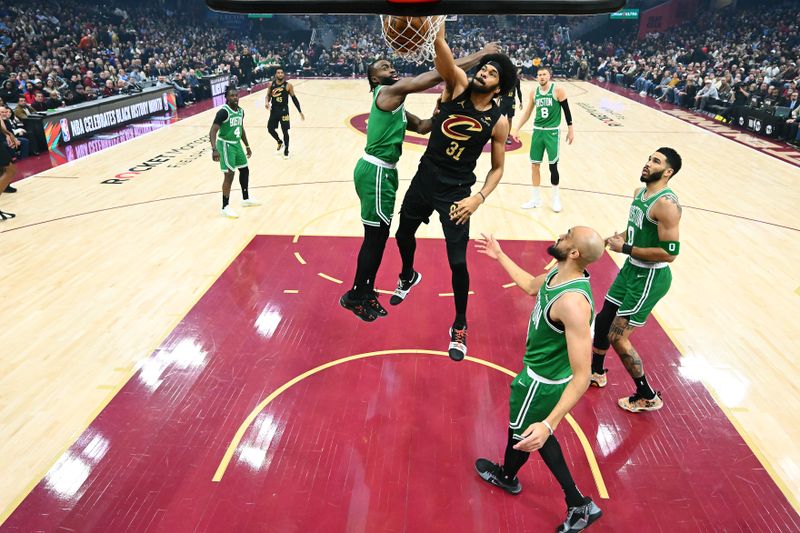 CLEVELAND, OHIO - FEBRUARY 04: Jarrett Allen #31 of the Cleveland Cavaliers dunks over Jaylen Brown #7 Jayson Tatum #0 and Derrick White #9 of the Boston Celtics during the first quarter at Rocket Mortgage Fieldhouse on February 04, 2025 in Cleveland, Ohio. The Celtics defeated the Cavaliers 112-105. NOTE TO USER: User expressly acknowledges and agrees that, by downloading and or using this photograph, User is consenting to the terms and conditions of the Getty Images License Agreement. (Photo by Jason Miller/Getty Images)