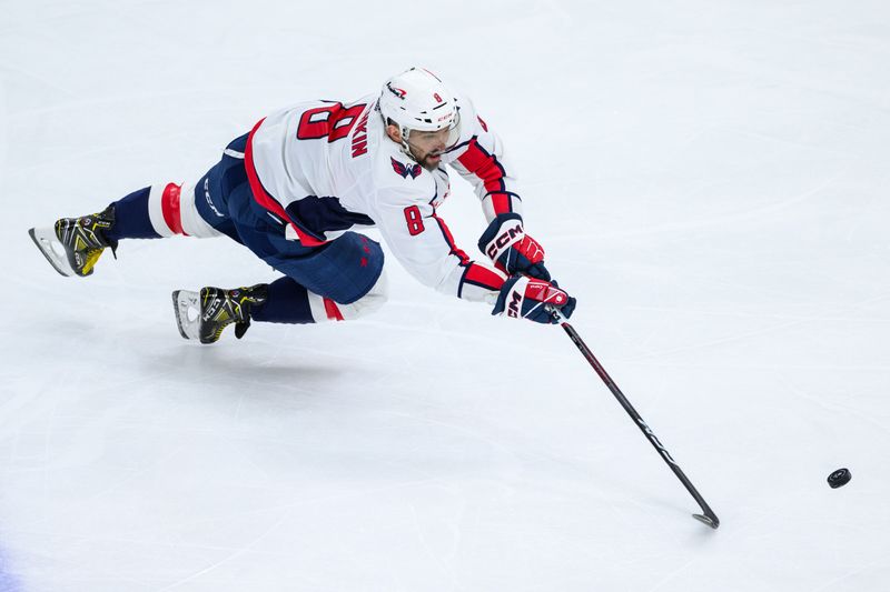 Dec 10, 2023; Chicago, Illinois, USA; Washington Capitals left wing Alex Ovechkin (8) dives after a puck against the Chicago Blackhawks during the third period at the United Center. Mandatory Credit: Daniel Bartel-USA TODAY Sports
