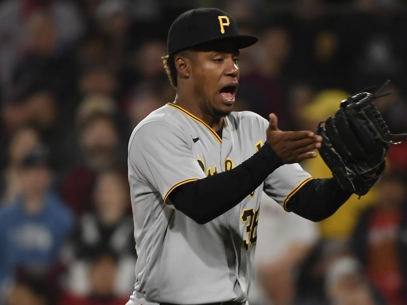 Apr 4, 2023; Boston, Massachusetts, USA;  Pittsburgh Pirates relief pitcher Dauri Moreta (36) reacts after pitching out of a jam during the sixth inning against the Boston Red Sox at Fenway Park. Mandatory Credit: Bob DeChiara-USA TODAY Sports