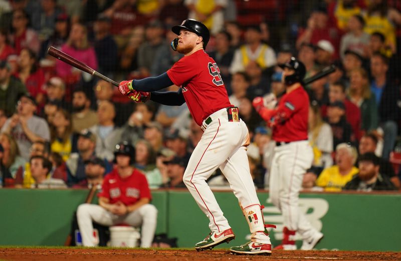 Jun 14, 2023; Boston, Massachusetts, USA; Boston Red Sox right fielder Alex Verdugo (99) hits a double to left field to drive in a run against the Colorado Rockies in the seventh inning at Fenway Park. Mandatory Credit: David Butler II-USA TODAY Sports