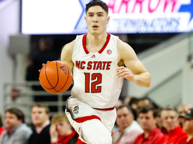 Dec 20, 2023; Raleigh, North Carolina, USA; North Carolina State Wolfpack guard Michael O'Connell (12) dribbles with the ball during the first half against Saint Louis at PNC Arena. Mandatory Credit: Jaylynn Nash-USA TODAY Sports