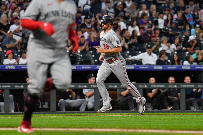 Sep 30, 2023; Denver, Colorado, USA; Minnesota Twins left fielder Matt Wallner (38) scores on a RBI single by Minnesota Twins catcher Christian Vazquez in the first inning against the Colorado Rockies at Coors Field. Mandatory Credit: John Leyba-USA TODAY Sports