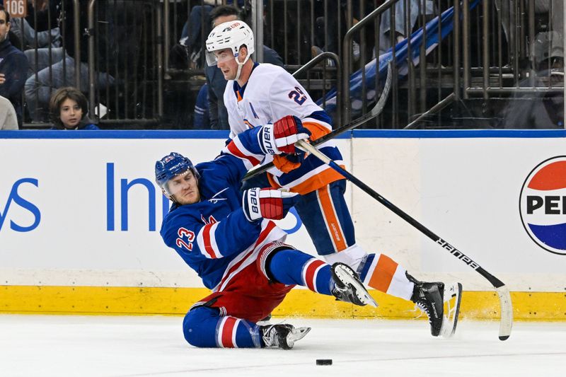 Apr 13, 2024; New York, New York, USA;  New York Islanders center Brock Nelson (29) checks New York Rangers defenseman Adam Fox (23) during the third period at Madison Square Garden. Mandatory Credit: Dennis Schneidler-USA TODAY Sports