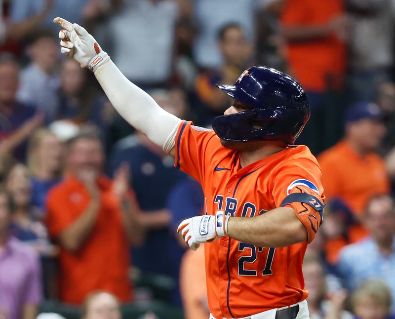 Jul 12, 2024; Houston, Texas, USA;  Houston Astros second baseman Jose Altuve (27) celebrates his three run home run against the Texas Rangers in the sixth inning at Minute Maid Park. Mandatory Credit: Thomas Shea-USA TODAY Sports