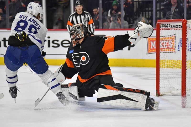 Mar 19, 2024; Philadelphia, Pennsylvania, USA; Toronto Maple Leafs right wing William Nylander (88) has his shot stopped by Philadelphia Flyers goaltender Samuel Ersson (33) during the second period at Wells Fargo Center. Mandatory Credit: Eric Hartline-USA TODAY Sports