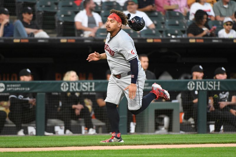 Sep 9, 2024; Chicago, Illinois, USA;  Cleveland Guardians first baseman Josh Naylor (22) loses his helmet before scoring against the Chicago White Sox during the first inning at Guaranteed Rate Field. Mandatory Credit: Matt Marton-Imagn Images