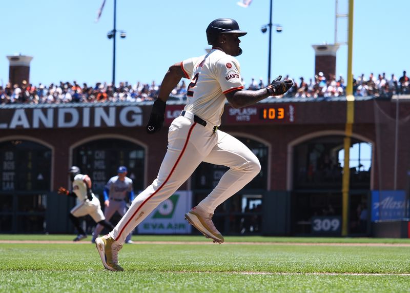 Jun 30, 2024; San Francisco, California, USA; San Francisco Giants designated hitter Jorge Soler (2) runs home after a sacrifice fly for a run against the Los Angeles Dodgers during the first inning at Oracle Park. Mandatory Credit: Kelley L Cox-USA TODAY Sports