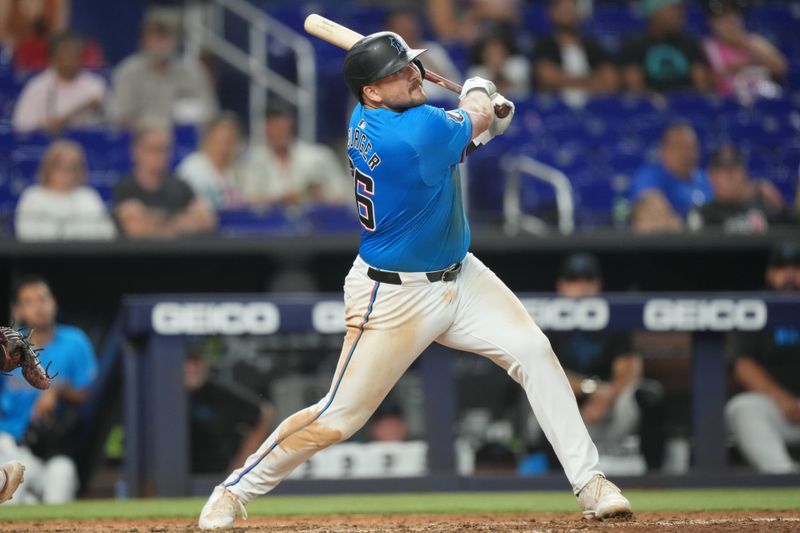 Jun 9, 2024; Miami, Florida, USA; Miami Marlins third baseman Jake Burger (36) hits a home run in the ninth inning against the Cleveland Guardians at loanDepot Park. Mandatory Credit: Jim Rassol-USA TODAY Sports