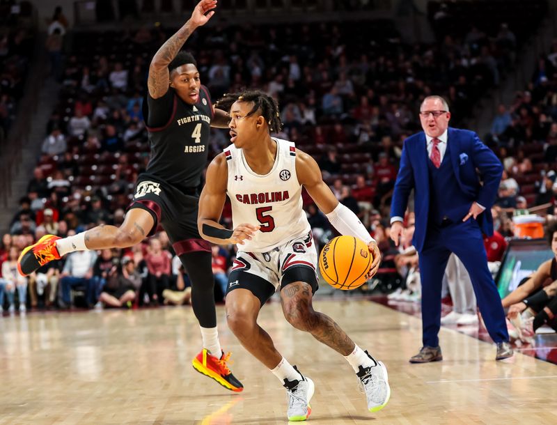 Jan 14, 2023; Columbia, South Carolina, USA; South Carolina Gamecocks guard Meechie Johnson (5) drives around Texas A&M Aggies guard Wade Taylor IV (4) in the first half at Colonial Life Arena. Mandatory Credit: Jeff Blake-USA TODAY Sports