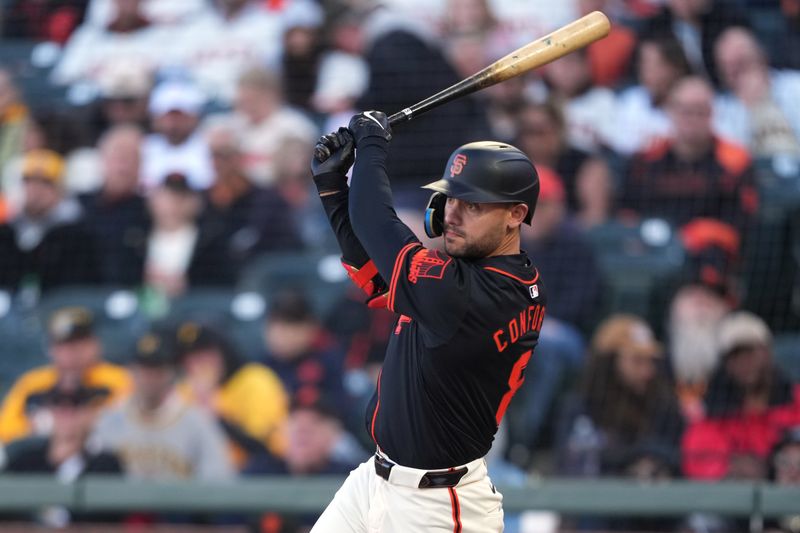 Apr 27, 2024; San Francisco, California, USA; San Francisco Giants left fielder Michael Conforto (8) hits a single during the third inning against the Pittsburgh Pirates at Oracle Park. Mandatory Credit: Darren Yamashita-USA TODAY Sports