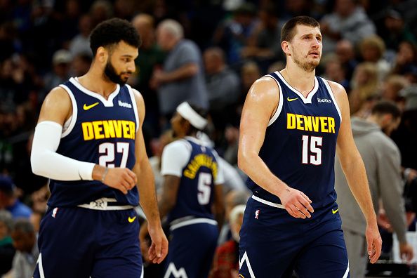 MINNEAPOLIS, MINNESOTA - NOVEMBER 01: Jamal Murray #27 and Nikola Jokic #15 of the Denver Nuggets look on against the Minnesota Timberwolves in the first quarter at Target Center on November 01, 2023 in Minneapolis, Minnesota. The Timberwolves defeated the Nuggets 110-89. NOTE TO USER: User expressly acknowledges and agrees that, by downloading and or using this photograph, User is consenting to the terms and conditions of the Getty Images License Agreement. (Photo by David Berding/Getty Images)