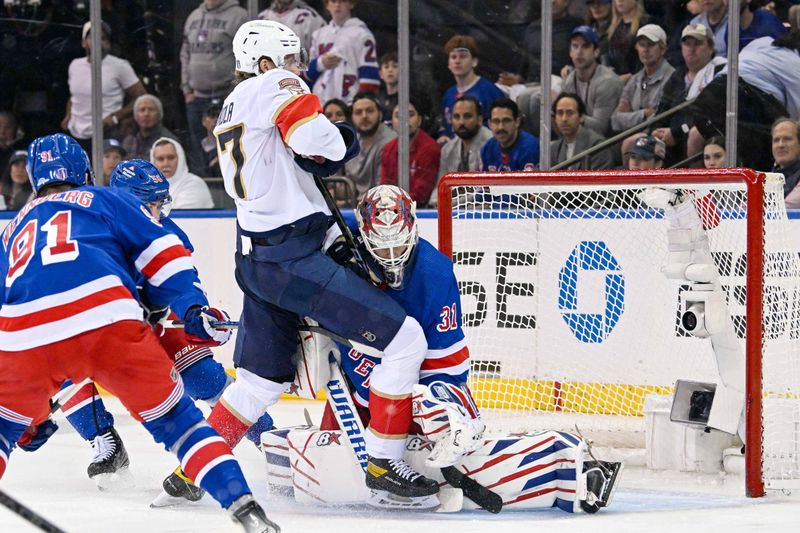 May 30, 2024; New York, New York, USA; Florida Panthers defenseman Niko Mikkola (77) runs into New York Rangers goaltender Igor Shesterkin (31) during the second period in game five of the Eastern Conference Final of the 2024 Stanley Cup Playoffs at Madison Square Garden. Mandatory Credit: Dennis Schneidler-USA TODAY Sports
