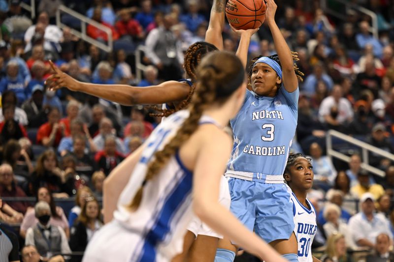 Mar 3, 2023; Greensboro, NC, USA; North Carolina Tar Heels guard Kennedy Todd-Williams (3) shoots during the first half at Greensboro Coliseum. Mandatory Credit: William Howard-USA TODAY Sports