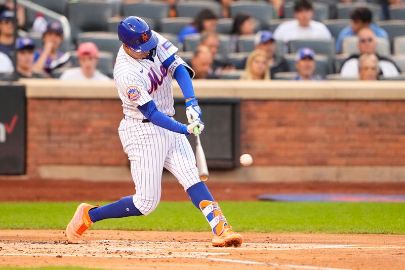 Aug 30, 2023; New York City, New York, USA;  New York Mets third baseman Mark Vientos (27) hits a single against the Texas Rangers during the second inning at Citi Field. Mandatory Credit: Gregory Fisher-USA TODAY Sports