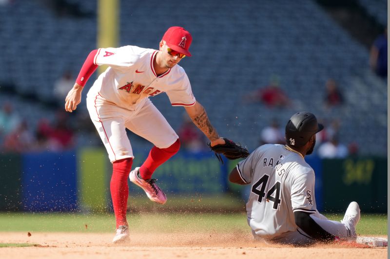 Sep 18, 2024; Anaheim, California, USA; Los Angeles Angels shortstop Zach Neto (9) tags out Chicago White Sox third baseman Bryan Ramos (44) out at second base in the 10th inning at Angel Stadium. Mandatory Credit: Kirby Lee-Imagn Images