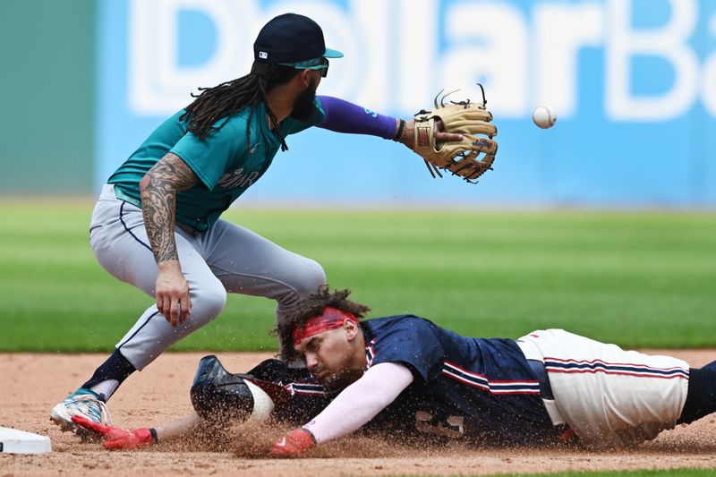 Jun 20, 2024; Cleveland, Ohio, USA; Cleveland Guardians first baseman Josh Naylor (22) slides into second with an RBI double as Seattle Mariners shortstop J.P. Crawford (3) waits for the throw during the fifth inning at Progressive Field. Mandatory Credit: Ken Blaze-USA TODAY Sports