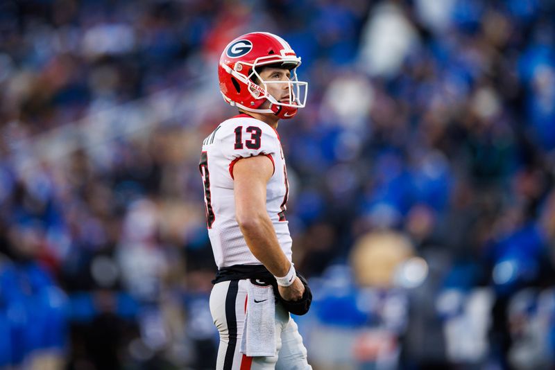 Nov 19, 2022; Lexington, Kentucky, USA; Georgia Bulldogs quarterback Stetson Bennett (13) looks on during the second quarter against the Kentucky Wildcats at Kroger Field. Mandatory Credit: Jordan Prather-USA TODAY Sports