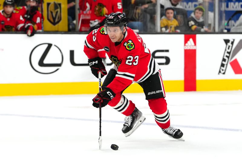 Oct 27, 2023; Las Vegas, Nevada, USA; Chicago Blackhawks center Philipp Kurashev (23) skates against the Vegas Golden Knights during an overtime period at T-Mobile Arena. Mandatory Credit: Stephen R. Sylvanie-USA TODAY Sports