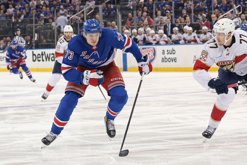 May 24, 2024; New York, New York, USA; New York Rangers center Matt Rempe (73) skates up ice as Florida Panthers defenseman Niko Mikkola (77) defends during the second period in game two of the Eastern Conference Final of the 2024 Stanley Cup Playoffs at Madison Square Garden. Mandatory Credit: Vincent Carchietta-USA TODAY Sports