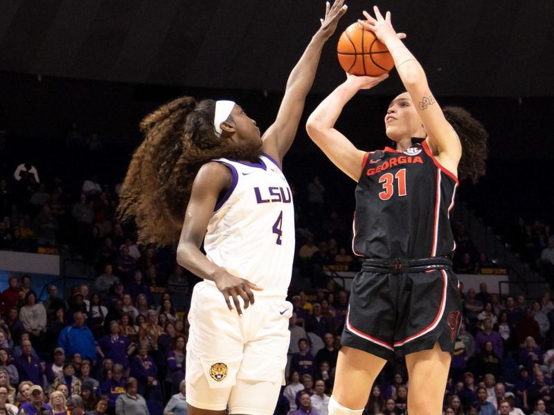 Feb 2, 2023; Baton Rouge, Louisiana, USA;  Georgia Lady Bulldogs guard Audrey Warren (31) shoots against LSU Lady Tigers guard Flau'jae Johnson (4) during the second half at Pete Maravich Assembly Center. Mandatory Credit: Stephen Lew-USA TODAY Sports