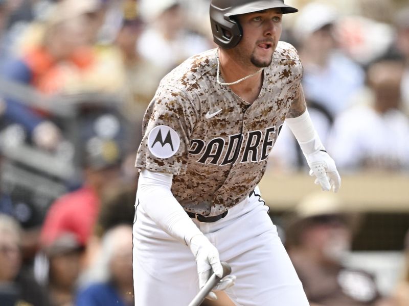 Sep 28, 2025; San Diego, California, USA; San Diego Padres center fielder Jackson Merrill (3) hits an RBI double during the first inning against the Arizona Diamondbacks at Petco Park. Mandatory Credit: Denis Poroy-Imagn Images