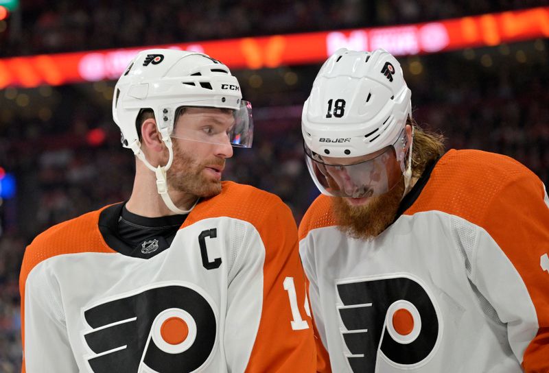 Apr 9, 2024; Montreal, Quebec, CAN; Philadelphia Flyers forward Sean Couturier (14) and teammate defenseman Marc Staal (18) prepares for a face off against the Montreal Canadiens during the second period at the Bell Centre. Mandatory Credit: Eric Bolte-USA TODAY Sports