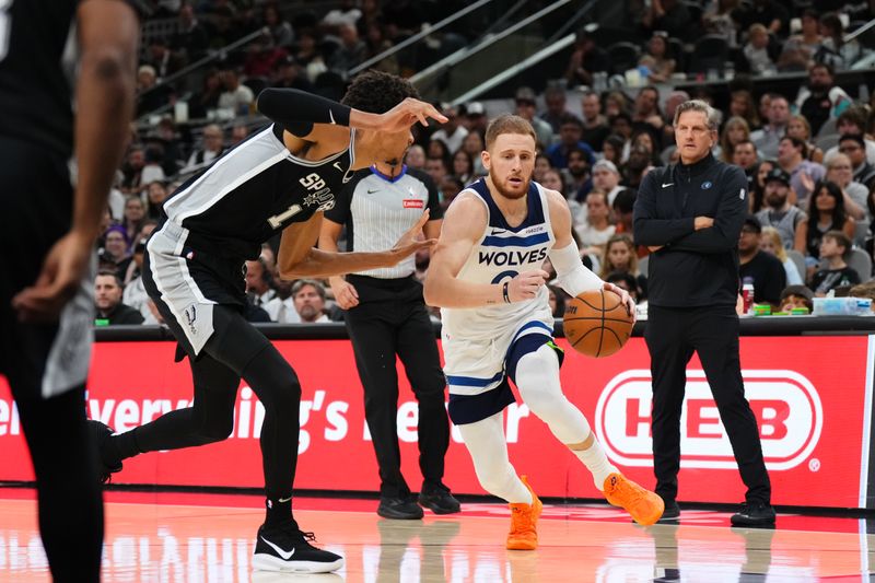 SAN ANTONIO, TX - NOVEMBER 2: Donte DiVincenzo #0 of the Minnesota Timberwolves drives to the basket during the game against the San Antonio Spurs on November 2, 2024 at the Frost Bank Center in San Antonio, Texas. NOTE TO USER: User expressly acknowledges and agrees that, by downloading and or using this photograph, user is consenting to the terms and conditions of the Getty Images License Agreement. Mandatory Copyright Notice: Copyright 2024 NBAE (Photos by Cooper Neill/NBAE via Getty Images)