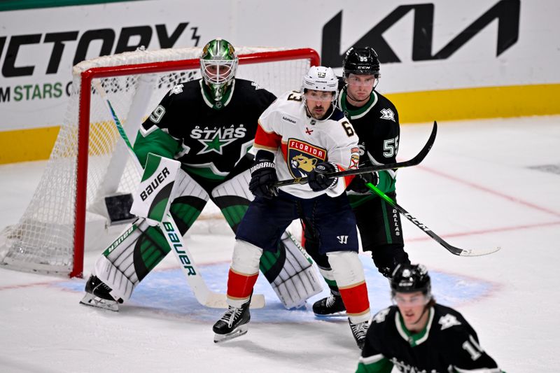 Dec 13, 2025; Dallas, Texas, USA; Florida Panthers left wing Brad Marchand (63) skates in front of Dallas Stars goaltender Jake Oettinger (29) and defenseman Thomas Harley (55) during the second period at the American Airlines Center. Mandatory Credit: Jerome Miron-Imagn Images