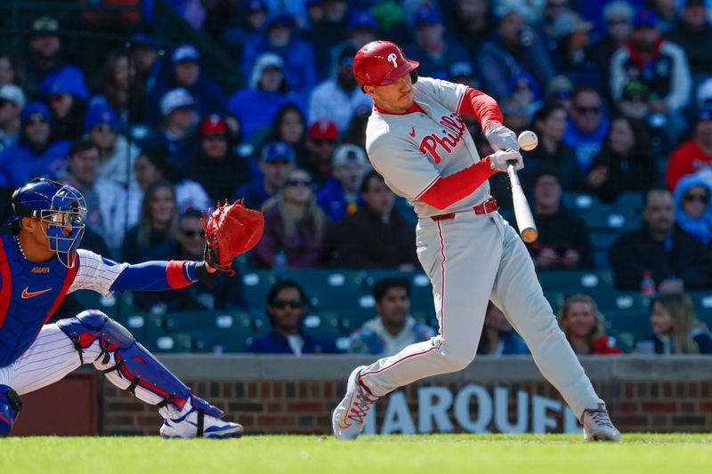 Apr 26, 2025; Chicago, Illinois, USA; Philadelphia Phillies catcher J.T. Realmuto (10) breaks his bat on a single against the Chicago Cubs during the fourth inning at Wrigley Field. Mandatory Credit: Kamil Krzaczynski-Imagn Images