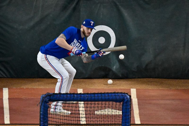 Oct 28, 2023; Arlington, Texas, USA; Texas Rangers catcher Jonah Heim (28) takes batting practice before the game between the Texas Rangers and the Arizona Diamondbacks in game two of the 2023 World Series at Globe Life Field. Mandatory Credit: Jerome Miron-USA TODAY Sports