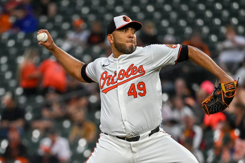 Sep 17, 2024; Baltimore, Maryland, USA;  Baltimore Orioles pitcher Albert Suárez (49) throws a first inning pitch against the San Francisco Giants at Oriole Park at Camden Yards. Mandatory Credit: Tommy Gilligan-Imagn Images