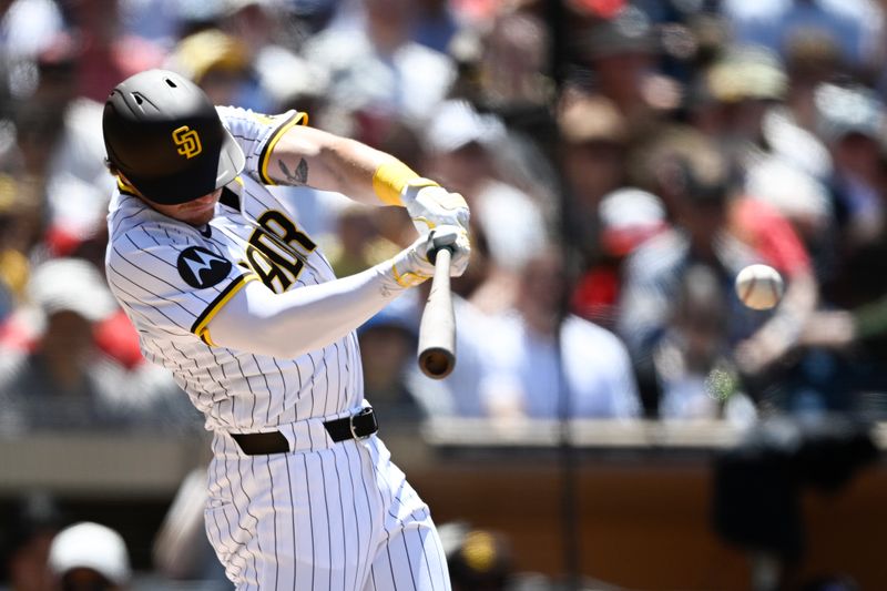 Jun 25, 2025; San Diego, California, USA; San Diego Padres left fielder Bryce Johnson (29) hits a single during the fourth inning against the Washington Nationals at Petco Park. Mandatory Credit: Denis Poroy-Imagn Images