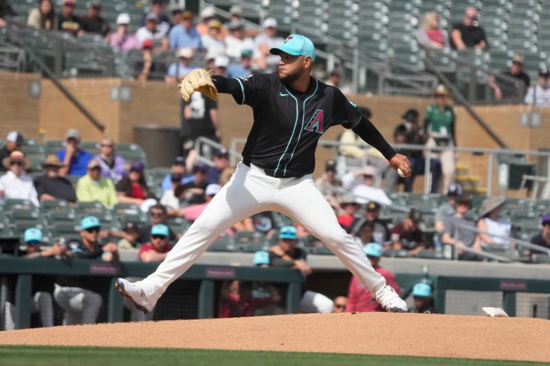 Feb 27, 2024; Salt River Pima-Maricopa, Arizona, USA; Arizona Diamondbacks starting pitcher Eduardo Rodriguez (57) throws against the Texas Rangers during the first inning at Salt River Fields at Talking Stick. Mandatory Credit: Rick Scuteri-USA TODAY Sports