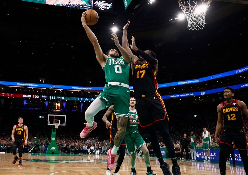 BOSTON, MA - FEBRUARY 7: Jayson Tatum #0 of the Boston Celtics shoots against Onyeka Okongwu #17 of the Atlanta Hawks during the second half at TD Garden on February 7, 2024 in Boston, Massachusetts. NOTE TO USER: User expressly acknowledges and agrees that, by downloading and/or using this Photograph, user is consenting to the terms and conditions of the Getty Images License Agreement. (Photo By Winslow Townson/Getty Images)