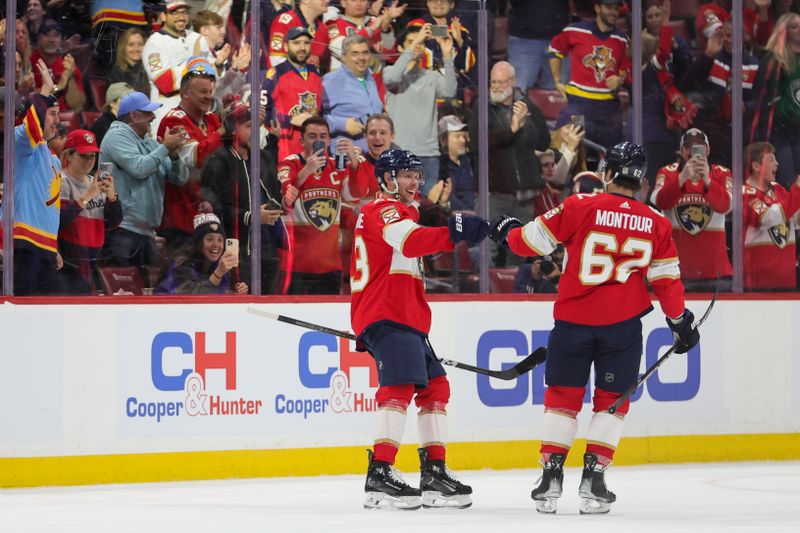 Feb 6, 2024; Sunrise, Florida, USA; Florida Panthers center Carter Verhaeghe (23) celebrates with defenseman Brandon Montour (62) after scoring against the Philadelphia Flyers during the first period at Amerant Bank Arena. Mandatory Credit: Sam Navarro-USA TODAY Sports