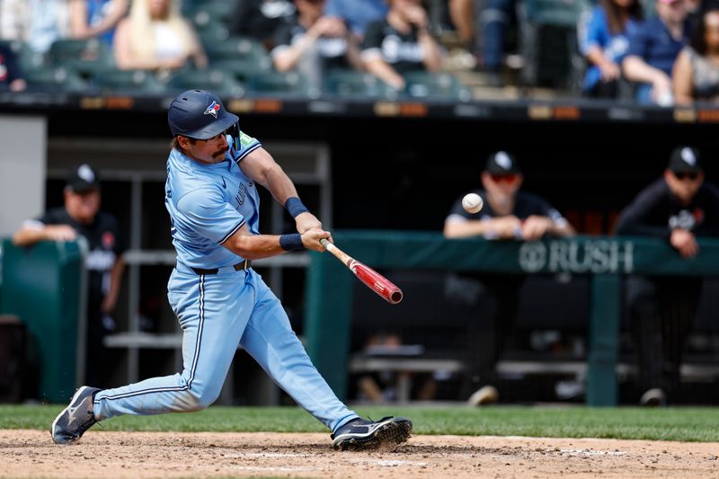 May 27, 2024; Chicago, Illinois, USA; Toronto Blue Jays outfielder Davis Schneider (36) hits a two-run home run against the Chicago White Sox during the ninth inning at Guaranteed Rate Field. Mandatory Credit: Kamil Krzaczynski-USA TODAY Sports