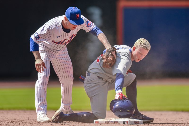 May 2, 2024; New York City, New York, USA; Chicago Cubs outfielder Pete Crow-Armstrong (52) beats a tag by New York Mets second baseman Joey Wendle (13) after hitting a RBI double during the sixth inning at Citi Field. Mandatory Credit: John Jones-USA TODAY Sports