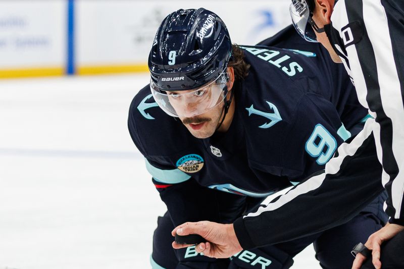 Oct 8, 2024; Seattle, Washington, USA; Seattle Kraken center Chandler Stephenson (9) looks on before a face off against the St. Louis Blues during the first period at Climate Pledge Arena. Mandatory Credit: Caean Couto-Imagn Images