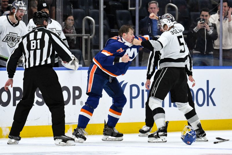 Dec 9, 2023; Elmont, New York, USA; New York Islanders defenseman Scott Mayfield (24) and Los Angeles Kings defenseman Andreas Englund (5) exchange blows during the second period at UBS Arena. Mandatory Credit: John Jones-USA TODAY Sports