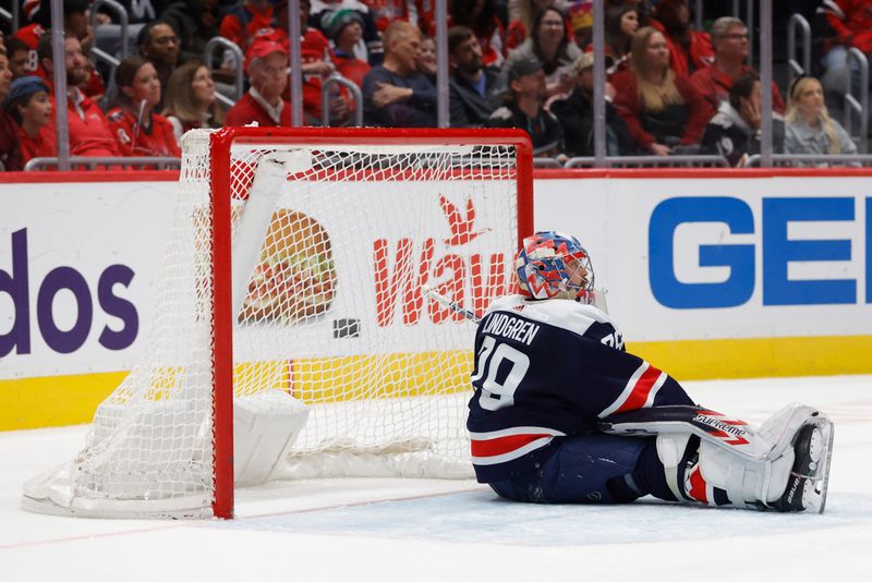 Nov 24, 2023; Washington, District of Columbia, USA; Washington Capitals goaltender Charlie Lindgren (79) sits on the ice after surrendering a goal to Edmonton Oilers center Leon Draisaitl (not pictured) in the second period at Capital One Arena. Mandatory Credit: Geoff Burke-USA TODAY Sports