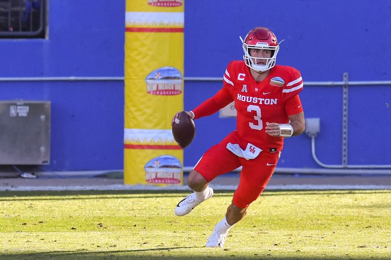 Dec 24, 2020; Frisco, Texas, USA;  Houston Cougars quarterback Clayton Tune (3) scrambles against Hawaii Warriors during the first half at Toyota Stadium. Mandatory Credit: Tim Flores-USA TODAY Sports